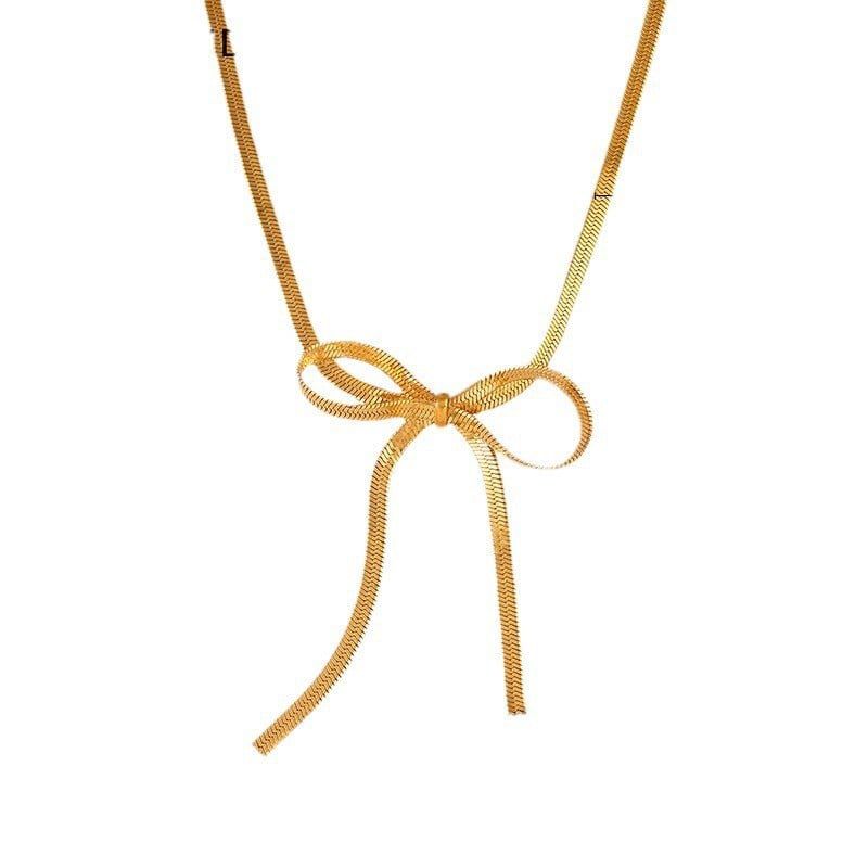 Collar de moña larga dorada